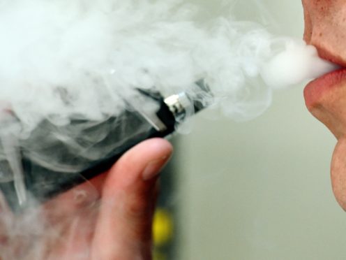 A man exhaling whilst using a vaping product (Nick Ansell/PA)