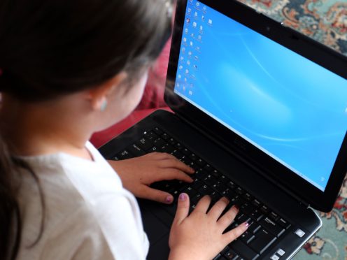 The Government pledged to provide 1.3 million digital devices to help disadvantaged children access remote education during the pandemic (Peter Byrne/PA)