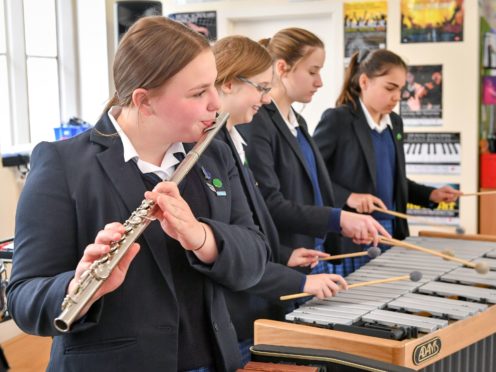 The SNP has announced plans to scrap music tuition fees in schools (PA)