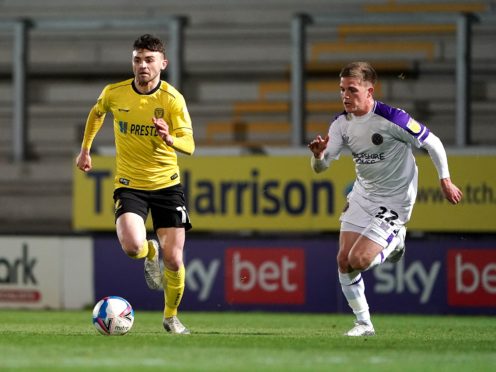 Burton’s Jonny Smith (left) is unlikely to feature against Lincoln (PA)