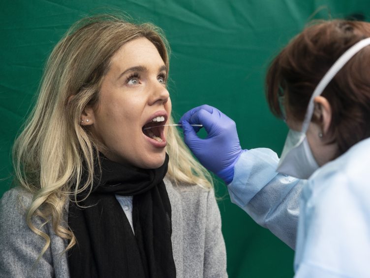 Those who have tested positive for Covid in past six months could qualify for a so-called vaccine passport (Brian Lawless/PA)