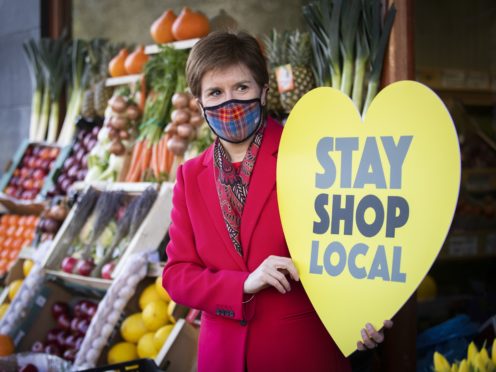 Nicola Sturgeon visits the Roots, Fruits and Flowers store in Glasgow’s West End (Jane Barlow/PA)