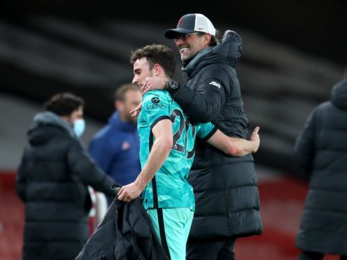 Diogo Jota (left) celebrates victory with manager Jurgen Klopp (Catherine Ivill/PA)