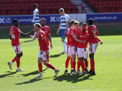 Lewis Grabban celebrates scoring the second Forest goal (PA)
