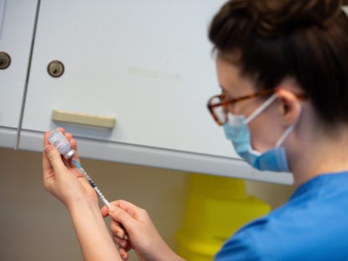 People over 16 in households of immunosuppressed adults are to be prioritised for jabs in Wales (Jacob King/PA)
