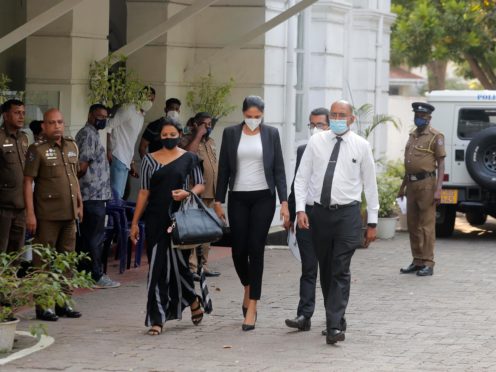 Caroline Jurie, centre, leaves a police station after being bailed in Colombo, Sri Lanka (AP/Eranga Jayawardena)