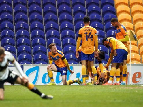 Mansfield celebrate Tyrese Sinclair’s late equaliser against Newport (Zac Goodwin/PA)