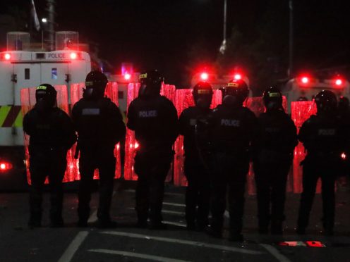 Members of the PSNI in the Tiger’s Bay area of North Belfast (Brian Lawless/PA)