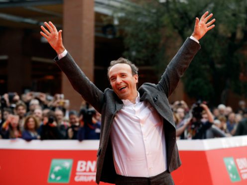 Roberto Benigni poses for photographers as he arrives on the red carpet at the Rome Film Festival (Gregorio Borgia/AP)