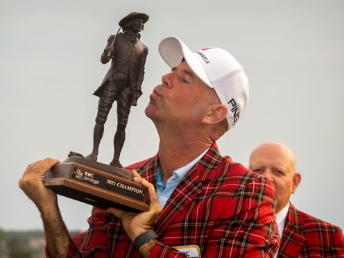 Stewart Cink kisses the championship trophy after winning the final round of the RBC Heritage golf tournament in Hilton Head Island, South Carolina (Stephen Morton/AP)