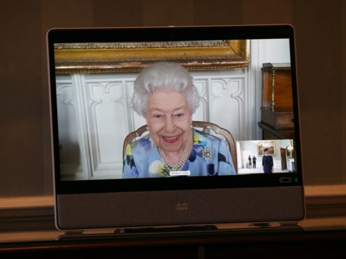 The Queen appears on a screen by videolink from Windsor Castle (Yui Mok/PA)