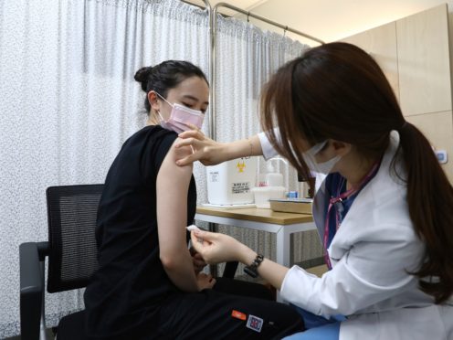 South Korean Olympic table tennis team player Jeon Ji-Hee receives the first dose of the Pfizer-BioNTech Covid-19 coronavirus vaccine (Chung Sung-Jun/AP)
