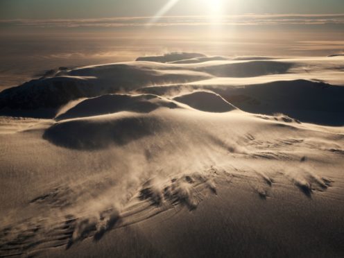Strong, warm mountain winds blowing snow as they descend slopes of the Antarctic Peninsula above the Larsen C Ice Shelf (Dr Andrew Elvidge/University of East Anglia)