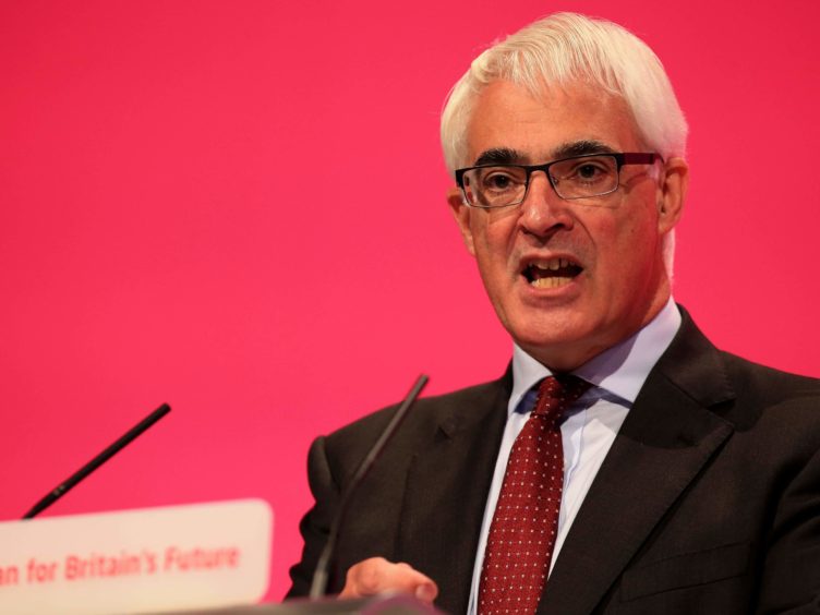 Alistair Darling is urging votes in Tory seats to give their second votes to Labour (Peter Byrne/PA)