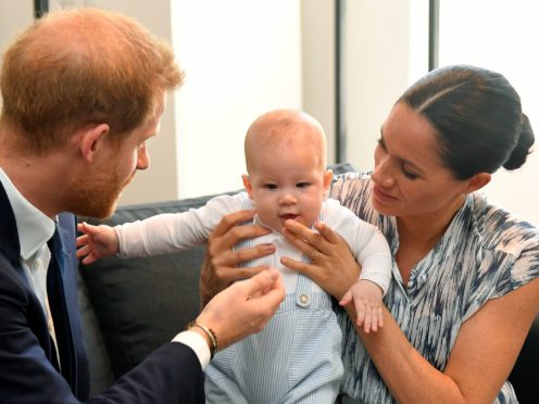 The Duke and Duchess of Sussex with Archie (Toby Melville/PA)