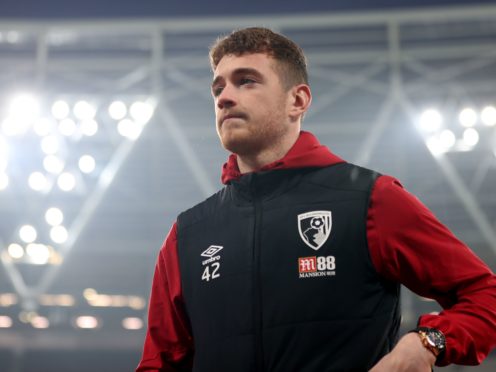 Bournemouth goalkeeper Mark Travers walks the pitch prior to the Premier League match at the London Stadium.