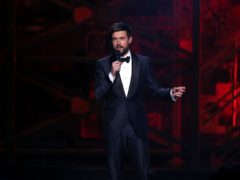 Jack Whitehall on stage at the Brit Awards 2020 (Isabel Infantes/PA)