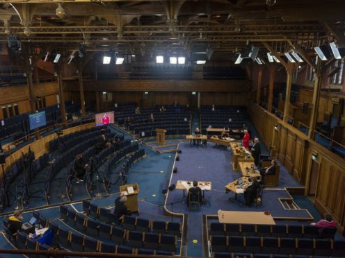 Ministers, elders, deacons and special guests are taking part in a ‘blended’ General Assembly for the second year running (Church of Scotland/PA)
