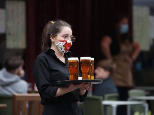 Businesses like pubs that had been closed since the new year were allowed to welcome customers back in April (Andrew Milligan/PA)