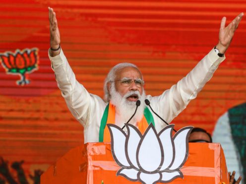 Indian Prime Minister Narendra Modi addresses a public rally ahead of West Bengal state elections in Kolkata, India (Bikas Das/AP)