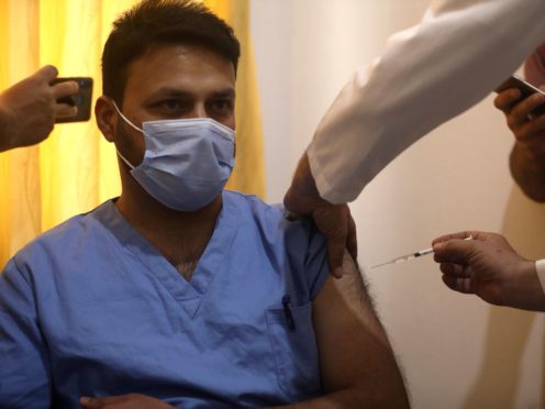 A Syrian nurse receives AstraZeneca COVID-19 vaccine in Idlib, Syria (Ghaith Alsayed/AP)