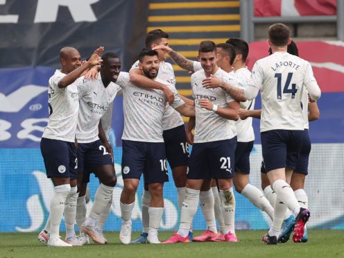 Manchester City players celebrate Sergio Aguero’s goal against Crystal Palace (Clive Rose/PA)