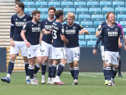 Billy Mitchell, centre right, is congratulated by team-mates after his first senior goal (Jonathan Brady/PA)