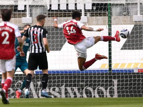 Arsenal’s Pierre-Emerick Aubameyang (right) scores at Newcastle on his return to the starting line-up (Stu Forster/PA)