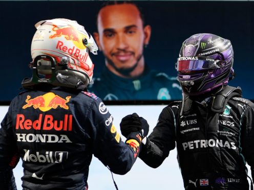 Lewis Hamilton and Max Verstappen shake hands after the race (Gabriel Bouys/AP)