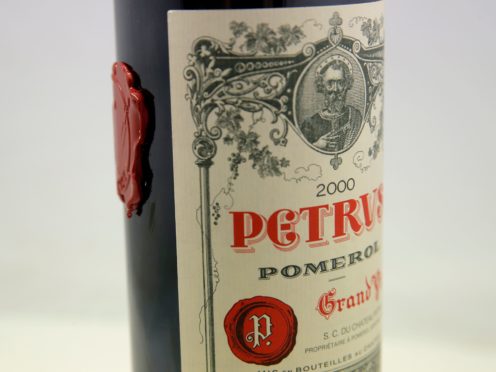 A bottle of Petrus red wine that spent a year orbiting the world in the International Space Station is pictured in Paris Monday, May 3, 2021. The bottle of French wine is up for a private sale at Christie’s, with a stratospheric price tag in the region of euro 1 million. (AP Photo/Christophe Ena)