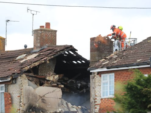 Firefighters inspect damage to a property in Mill View in Willesborough, near Ashford, Kent (Gareth Fuller/PA)