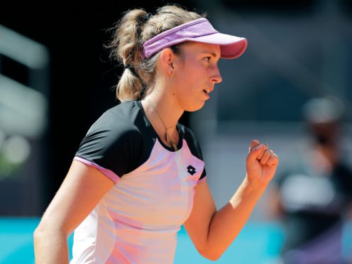Elise Mertens celebrates winning a point during her victory over Simona Halep (Paul White/AP)