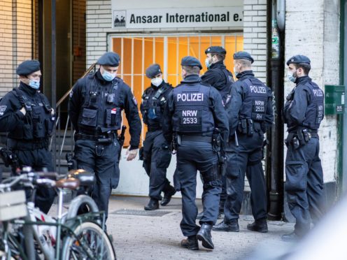 Police officers in front of a building of the Ansaar International association in Dusseldorf (dpa/AP)
