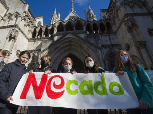 School children from Yerbury Primary School in Islington, north London, take part in a protest outside the High Court, London, against the building of a proposed Ocado depot near to their school. Ocado is going to the court seeking to overturn Islington Council’s decision to revoke their licence to open a 24/7 distribution centre near to the primary school. Picture date: Wednesday May 5, 2021.