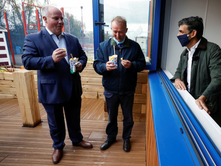 Rishi Sunak talks to Andrew RT Davies (left) and Simon Hart (centre) (Phil Noble/PA)