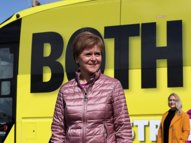 Nicola Sturgeon urged Scots to back her to take the country through the Covid pandemic and into a ‘brighter future’ (Russell Cheyne/PA)