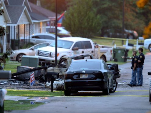 Police at the scene of the plane crash in Hattiesburg (Chuck Cook/AP)