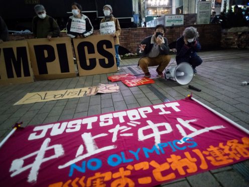 A banner opposing the Olympics is placed by protesters in Tokyo (AP)