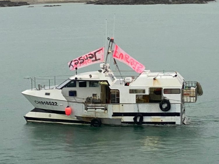 French fishing vessels stage a protest outside the harbour at St Helier, Jersey (Josh Dearing/PA)