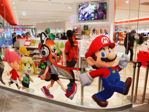Nintendo characters, including Mario, on the window of it store in Tokyo (AP)