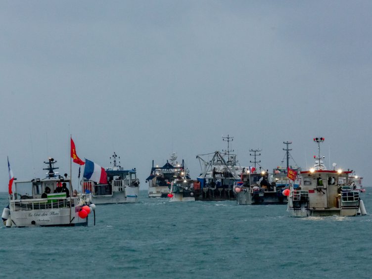 French fishing vessels stage a protest outside the harbour at St Helier (Gary Grimshaw/Bailiwick Express/PA)