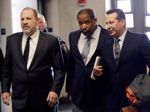 Harvey Weinstein, left, enters court with attorneys Ron Sullivan, center, and Jose Baez, in New York (Mark Lennihan/AP)