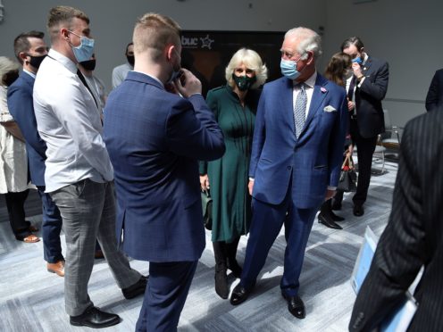 The Prince of Wales and the Duchess of Cornwall during a visit to the Education Authority Headquarters in Belfast (Clodagh Kilcoyne/PA)