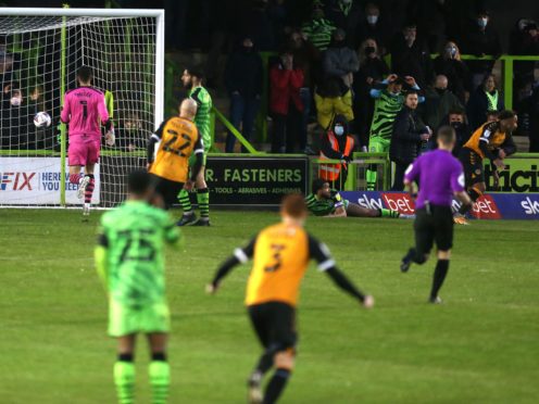 Nicky Maynard, far right, wheels away after scoring Newport’s winner (Steven Paston/PA)