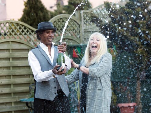 Nurse Teresa Robinson with partner Charlie Hobson (National Lottery/ PA)