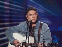 American Idol finalist Caleb Kennedy has left the talent show after footage emerged of him sitting next to someone wearing a white hood (ABC/Eric McCandless)