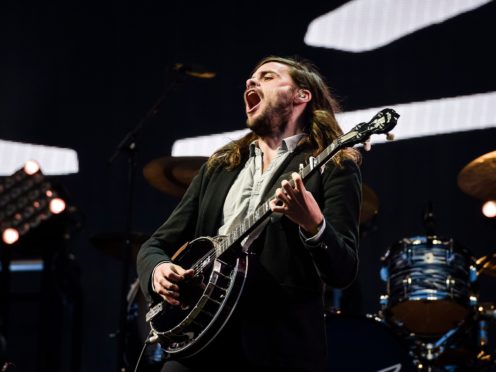 Winston Marshall performs with Mumford & Sons (PA)