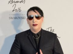 Marilyn Manson will turn himself in to authorities in Los Angeles over an alleged spitting incident in New Hampshire, police said (Matt Crossick/PA)