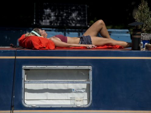 Time to top up the tan as UK heads for a heatwave (Kirsty O’Connor/PA)