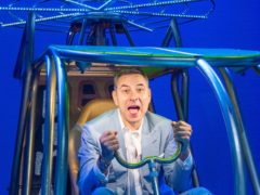 David Walliams tried out a model helicopter while visiting the West End adaptation of his children’s book Billionaire Boy (Dominic Lipinski/PA)